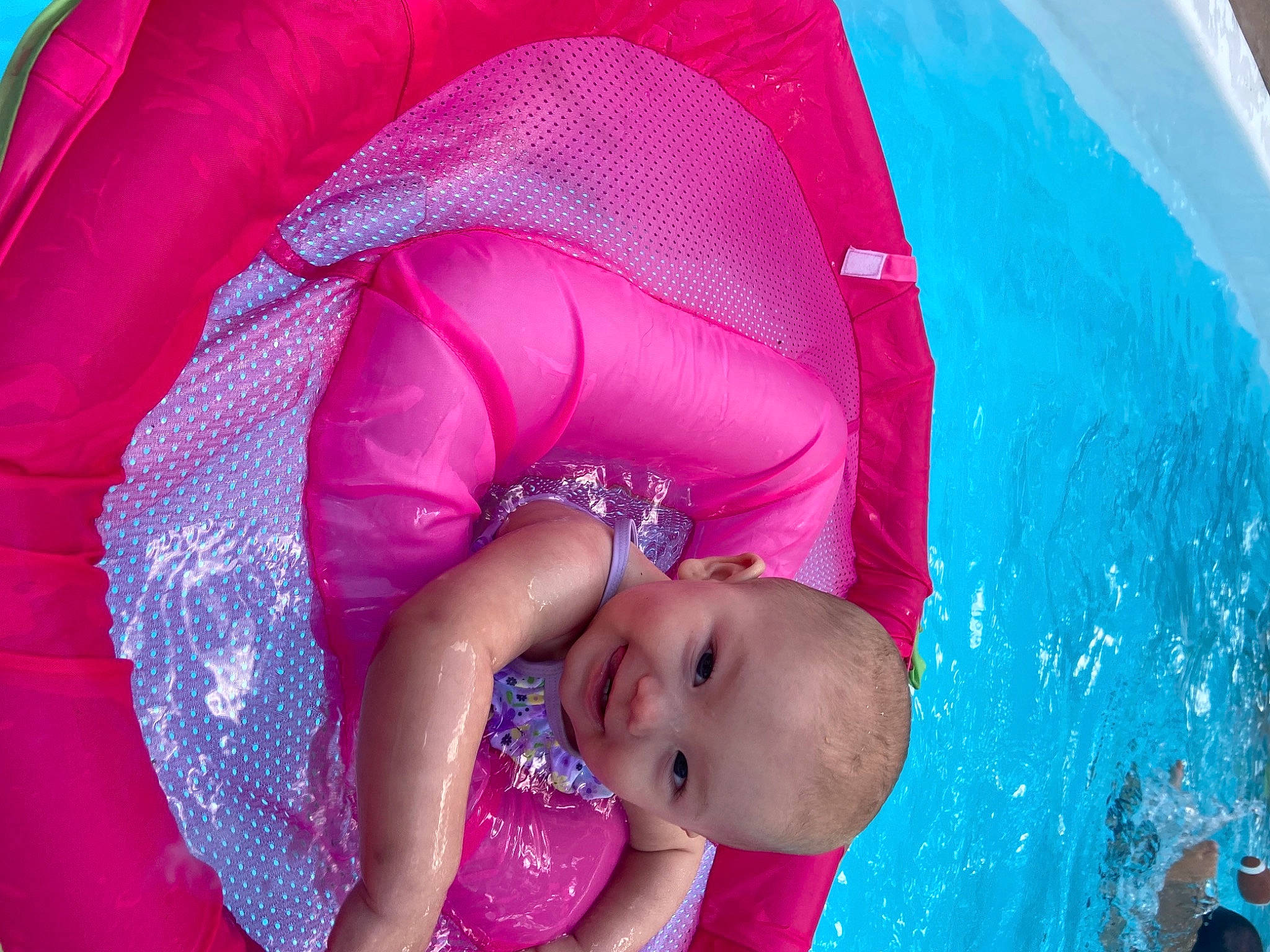 Lilyann is registered to the contest to win money with this photo: baby, baby_toddler_clothing, bathing, blue, chest, child, fashion_accessory, fun, happy, inflatable, joy, leisure, magenta, mouth, person, pink, play, purple, recreation, swimming_pool