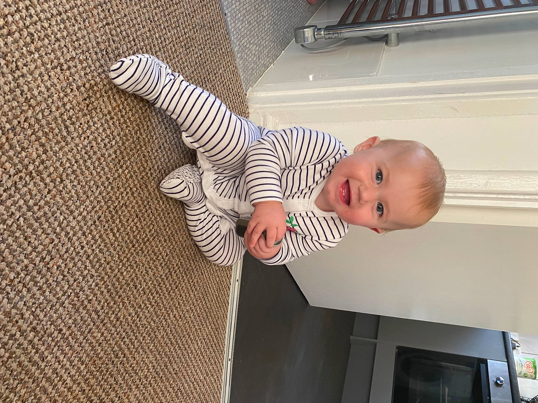 Olivia joined the competition — help win amazing prizes! baby, baby_products, baby_toddler_clothing, child, comfort, elbow, floor, flooring, gesture, happy, hardwood, human_body, leg, pattern, person, room, sleeve, smile, thumb, toddler