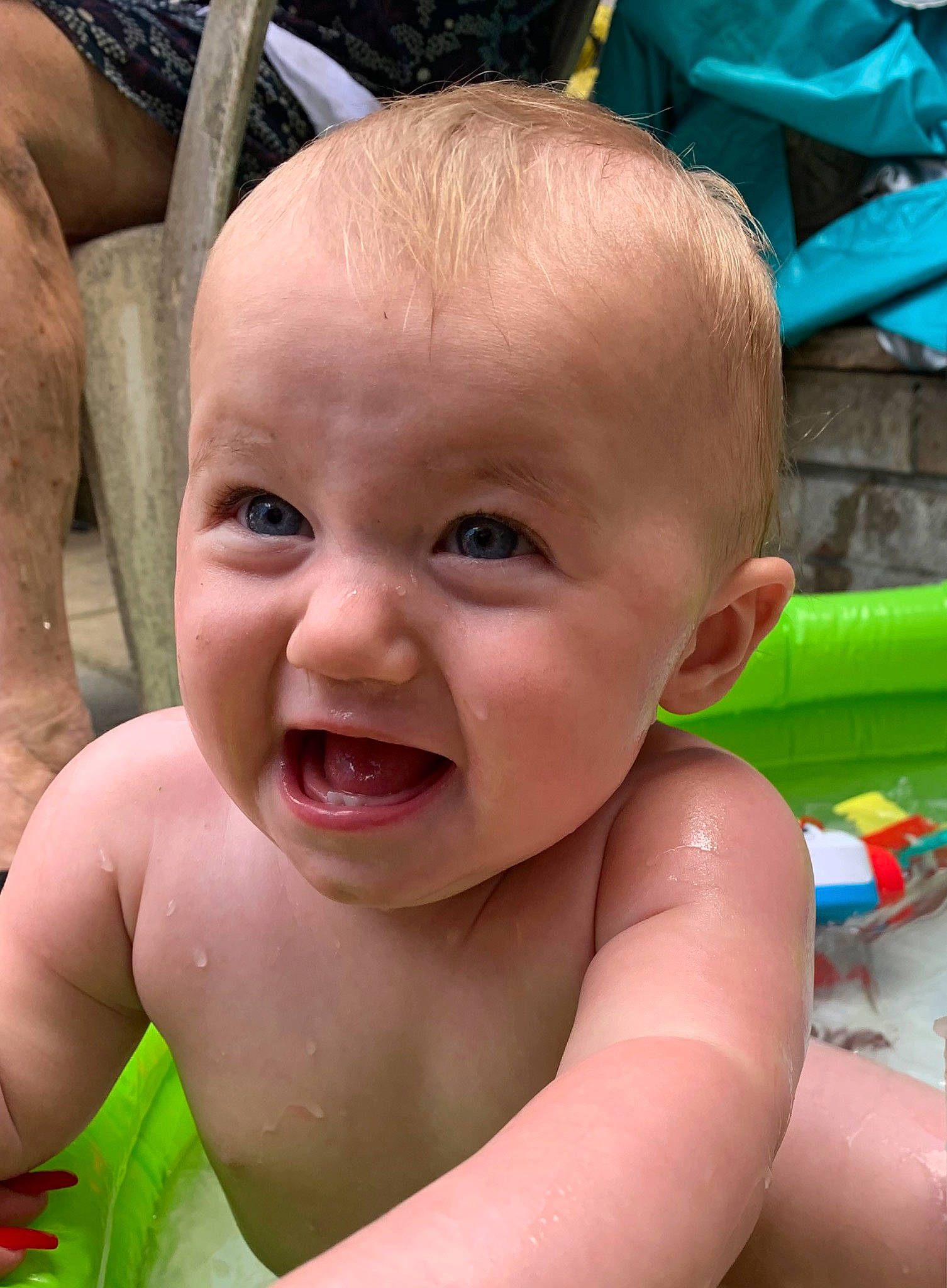 Olivia is registered to the contest to win money with this photo: baby_bathing, blue, cheek, chin, eye, eyebrow, face, facial_expression, green, hairstyle, head, jaw, lip, mouth, muscle, nose, organ, person, photograph, skin