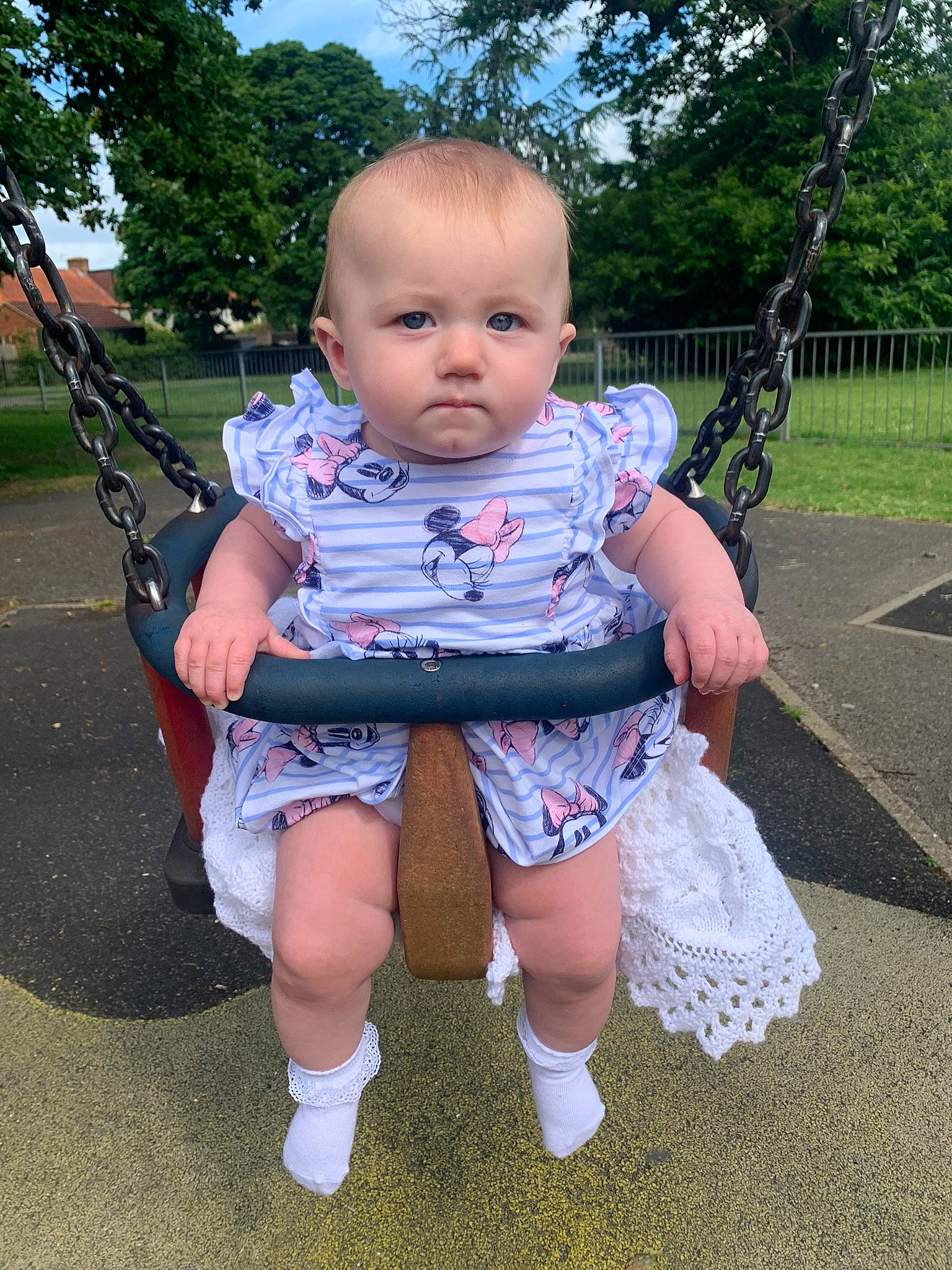 Olivia is registered to the contest to win money with this photo: baby, baby_toddler_clothing, black, cheek, child, eye, finger, fun, grass, happy, head, joint, leisure, person, pink, playground, product, summer, swing, toddler