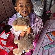 Miracle joined the competition — help win amazing prizes! bedroom, child, clothing, drawer, floor, girl, hair_buns, happy, indoor, jacket, laundry_basket, person, pink, plush_toy, shoes, smiling, storage, sunlight, teddy_bear, toy