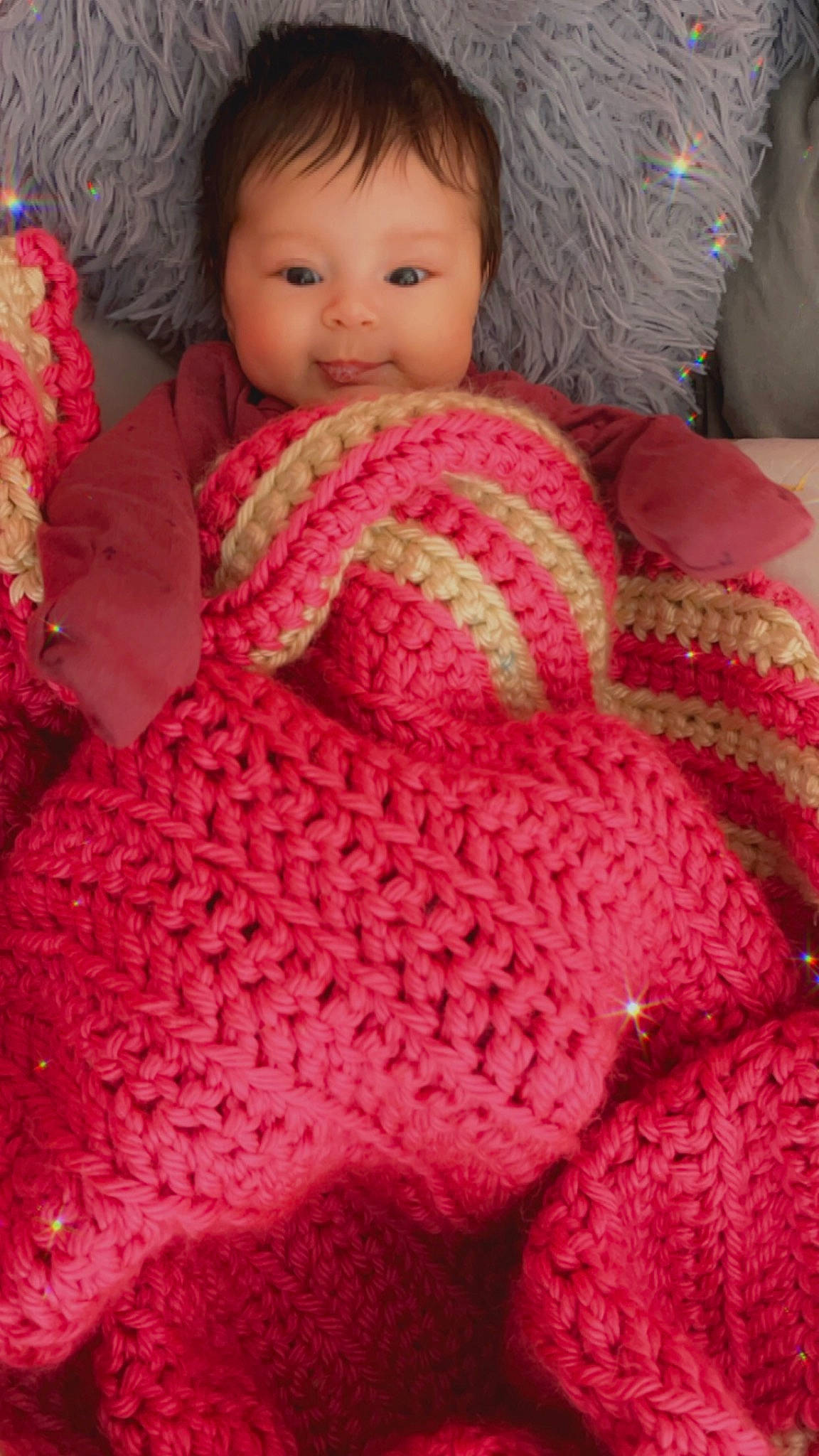 Elayna joined the competition — help win amazing prizes! art, baby, baby_toddler_clothing, cheek, creative_arts, finger, head, magenta, outerwear, pattern, person, pink, red, skin, sleeve, smile, textile, thumb, toddler, wool