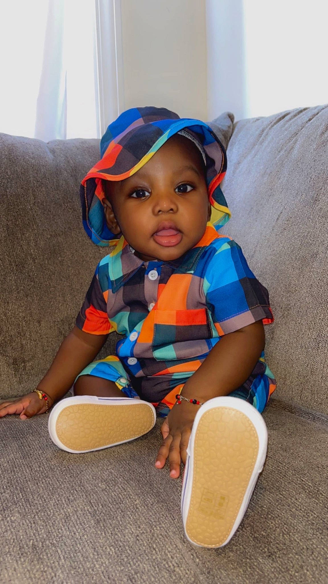 Aiden joined the competition — help win amazing prizes! baby, baby_products, baby_toddler_clothing, child, comfort, couch, electric_blue, fashion_accessory, fun, happy, headwear, pattern, person, play, sitting, sleeve, t_shirt, toddler, vacation