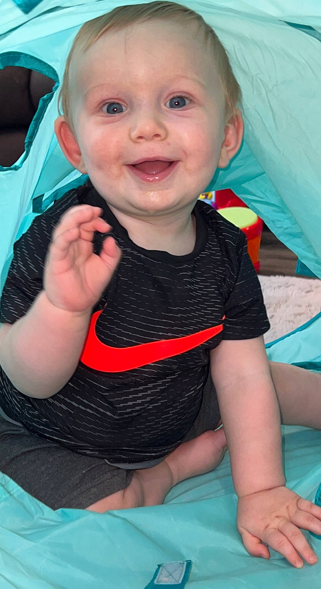 Jaxxon is registered to the contest to win money with this photo: baby, baby_toddler_clothing, blue, cheek, eye, facial_expression, finger, fun, gesture, happy, iris, lip, mouth, nose, person, pink, skin, sleeve, smile, thumb