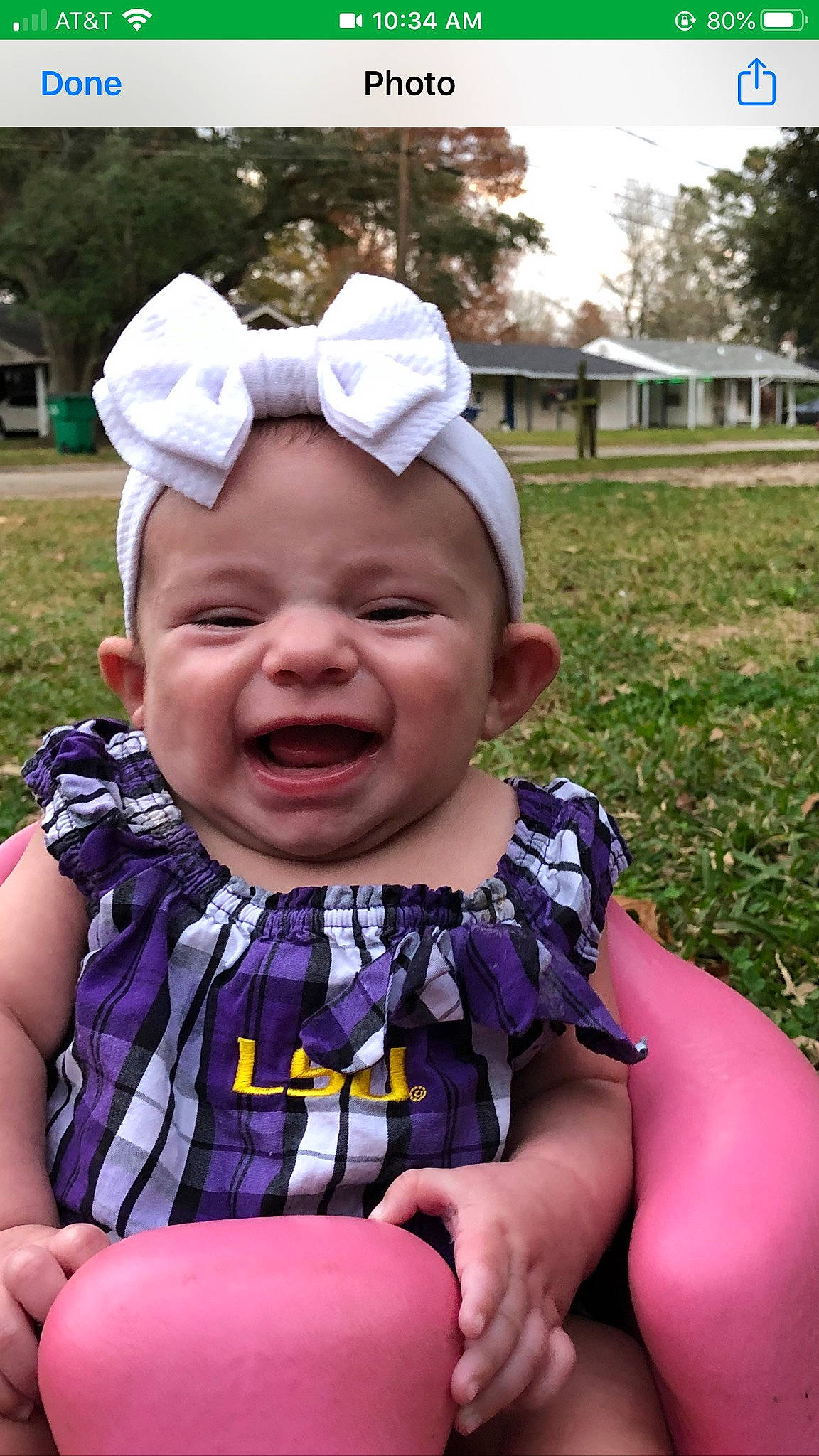 Malayah is registered to the contest to win money with this photo: baby, baby_laughing, baby_products, child, facial_expression, fun, grass, happy, headgear, laugh, person, pink, play, smile, toddler, tongue, tooth