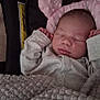 Skye is registered to the contest to win money with this photo: baby, sleeping, blanket, pillow, pink, cozy, infant, soft, cute, peaceful, child, face, clothing, resting, indoors, newborn, portrait, cute_baby, comfort, nap