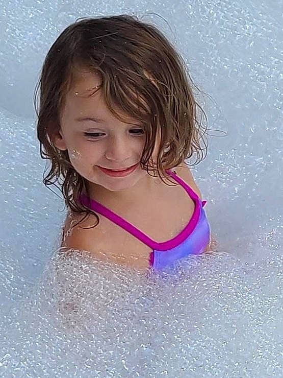 Lakelyn joined the competition — help win amazing prizes! arm, bathing, child, eye, face, facial_expression, flash_photography, fluid, fun, hair, happy, head, human_body, joy, leisure, person, pink, skin, smile, swimwear