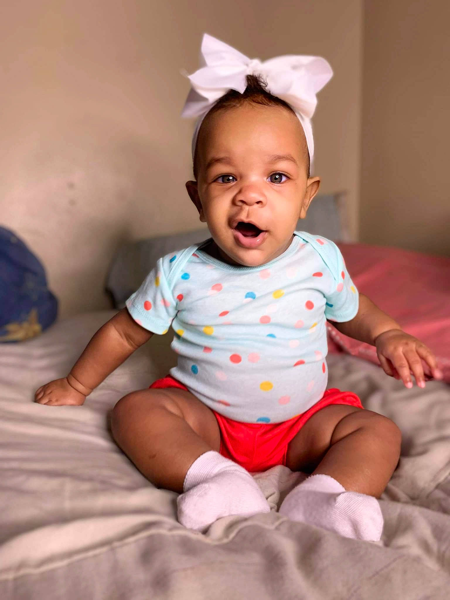 Lailani is registered to the contest to win money with this photo: arm, baby, baby_toddler_clothing, cheek, chin, comfort, eye, face, flash_photography, hairstyle, happy, head, iris, leg, lip, mouth, person, skin, sleeve, standing