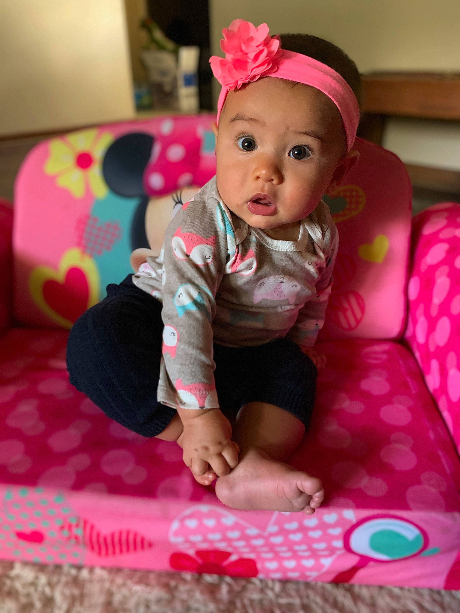 Mirabella is registered to the contest to win money with this photo: baby, baby_toddler_clothing, beauty, cheek, child, daughter, hair_accessory, headband, headgear, headpiece, person, pink, play, sitting, skin, smile, surprise, toddler
