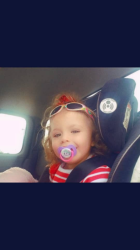 Aleeah is registered to the contest to win money with this photo: auto_part, car, car_seat, child, cool, driving, ear, eyewear, face, fun, lip, mouth, nose, person, photography, selfie, sky, smile, steering_wheel, toddler