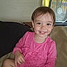 Nova joined the competition — help win amazing prizes! toddler, child, smile, pink_dress, sitting, couch, indoor, fan, curtain, happy, person, face, hair, clothing, home, furniture, portrait, cute, young_child, comfortable