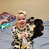 Nova joined the competition — help win amazing prizes! toddler, child, smiling, bed, stuffed_animals, toys, headband, mickey_mouse, clothing, socks, blanket, indoor, happy, cute, person, baby, fabric, room, playful, soft_toys