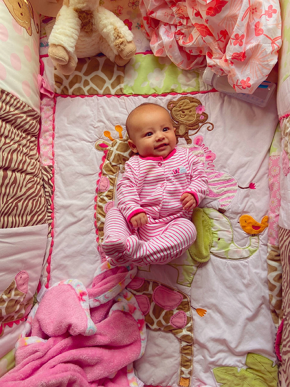 Nalicia Miamora is registered to the contest to win money with this photo: baby, baby_toddler_clothing, bed_sheet, bedding, child, comfort, dress, face, happy, linens, magenta, pattern, peach, person, petal, pink, product, sitting, sleeve, textile