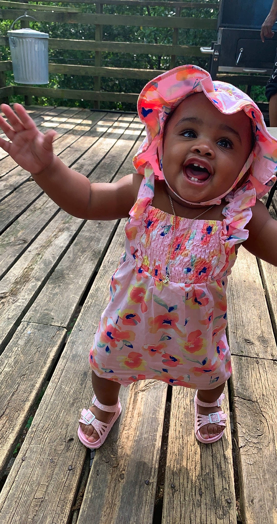 Harlem is registered to the contest to win money with this photo: baby, baby_toddler_clothing, baseball_cap, cap, child, fun, grass, green, hand, happy, headwear, leisure, magenta, pattern, person, pink, recreation, skin, sleeve, sneakers