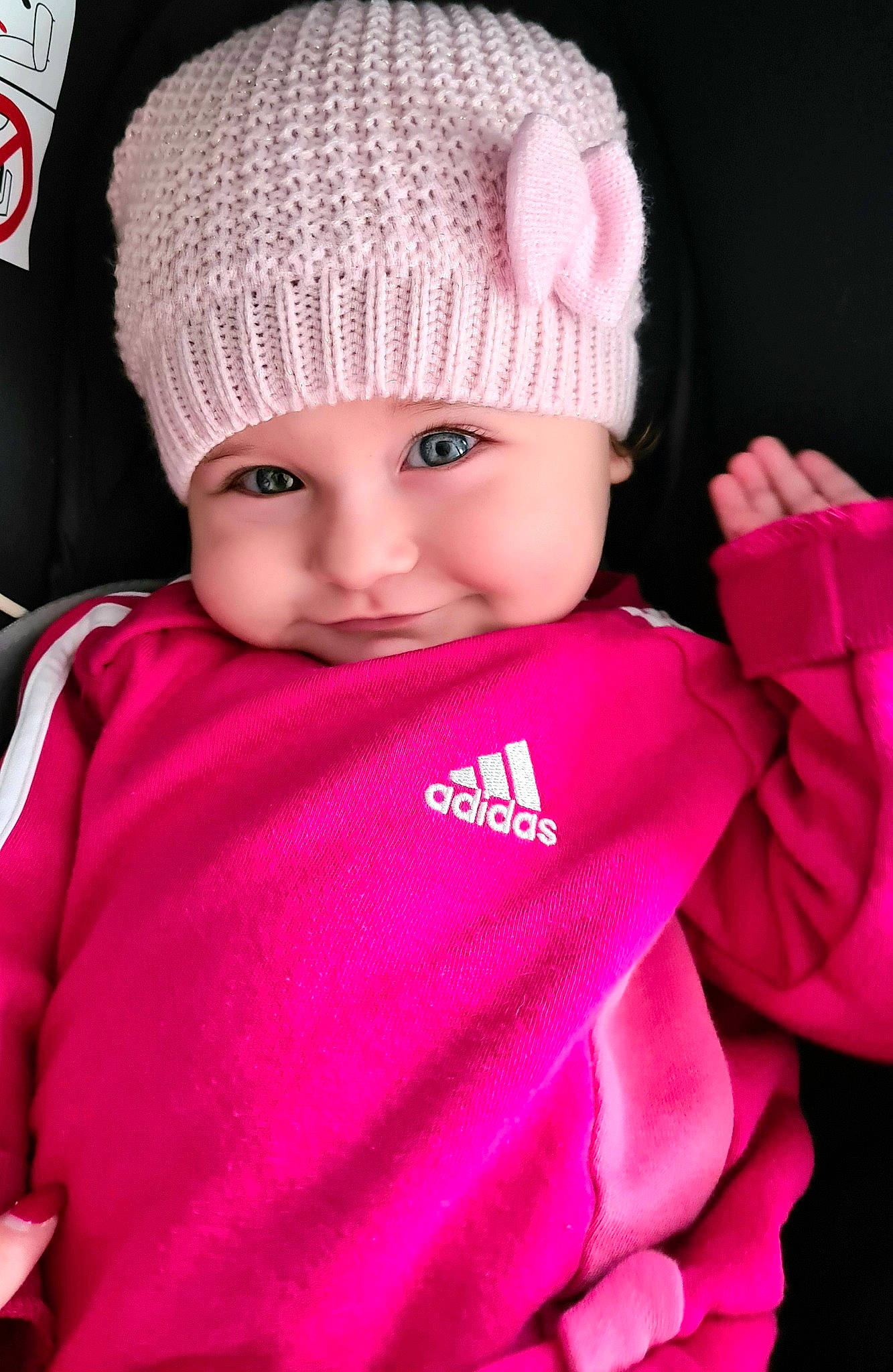 Alba participe au concours pour gagner de l'argent avec cette photo : baby, baby_toddler_clothing, black, cap, cheek, finger, hand, happy, headgear, headwear, magenta, outerwear, person, photograph, pink, product, purple, sleeve, smile, textile