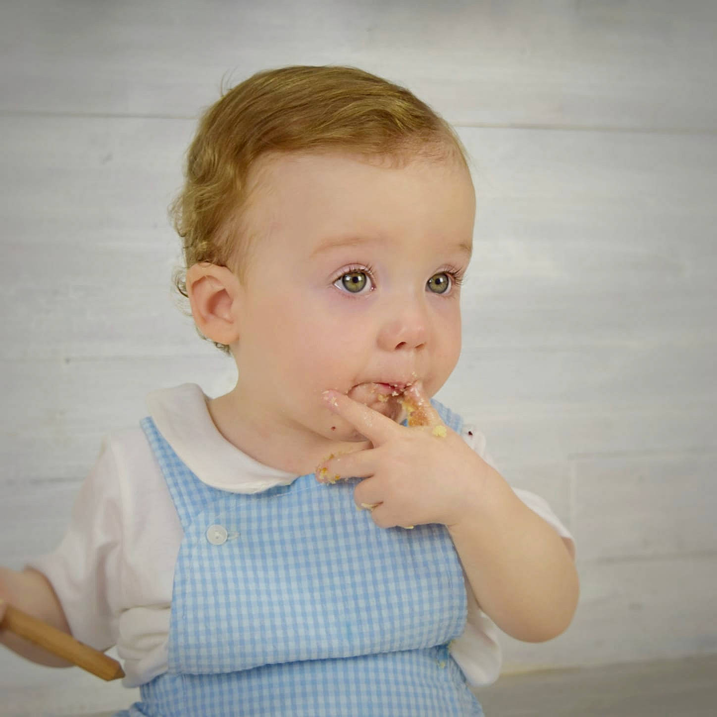 Arlo is registered to the contest to win money with this photo: baby, cheek, child, chin, eating, face, finger, gesture, nose, person, skin, toddler