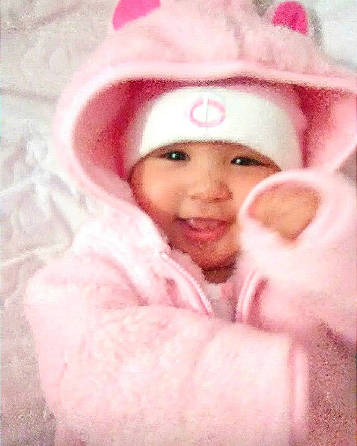 Sequoia is registered to the contest to win money with this photo: cheek, child, ear, eye, face, forehead, girl, hair_accessory, head, headwear, infant, lip, mouth, nose, person, pink, product, skin, smile, toddler