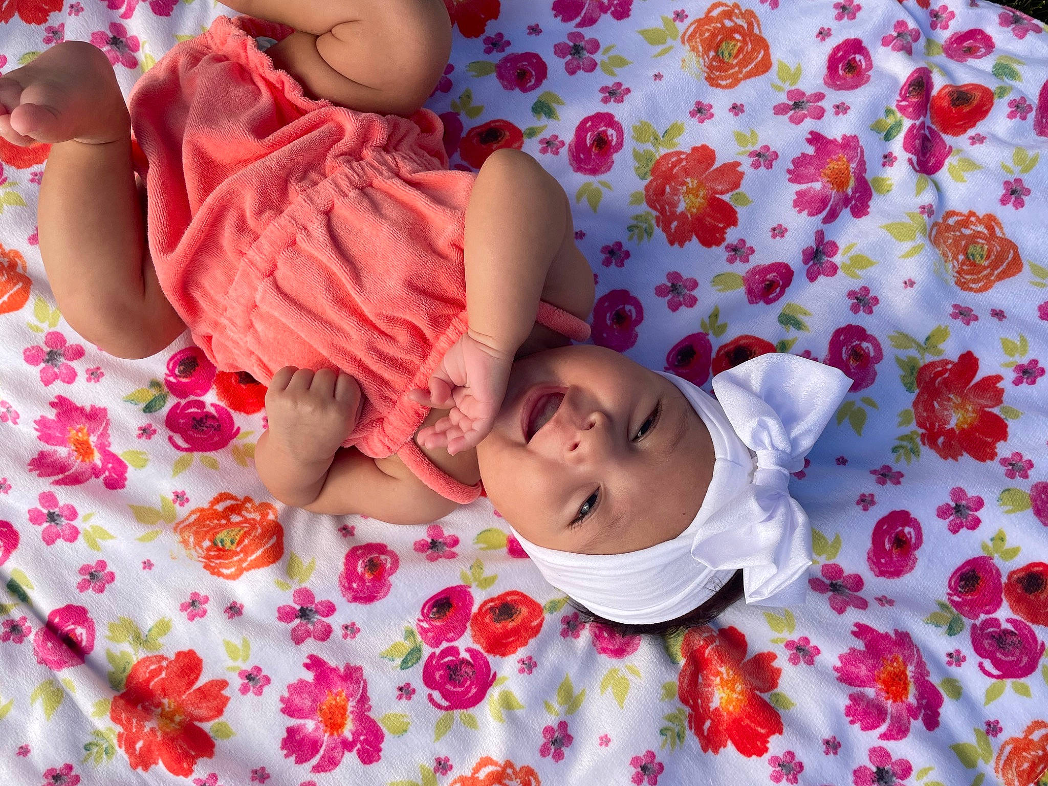 Blaise is registered to the contest to win money with this photo: arm, baby, baby_toddler_clothing, cheek, child, comfort, face, fun, happy, headwear, linens, magenta, pattern, person, pink, room, skin, sleeve, smile, textile