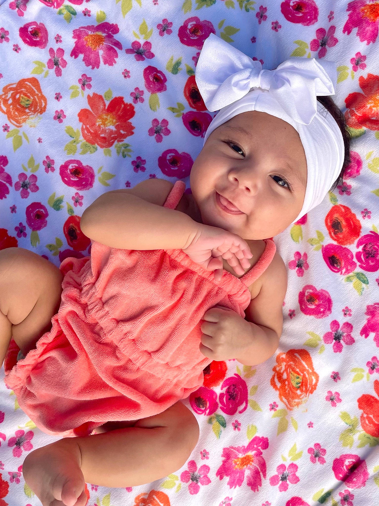 Blaise is registered to the contest to win money with this photo: arm, baby, baby_toddler_clothing, face, facial_expression, finger, happy, head, headgear, headwear, human_body, muscle, person, pink, product, purple, skin, sleeve, smile, textile