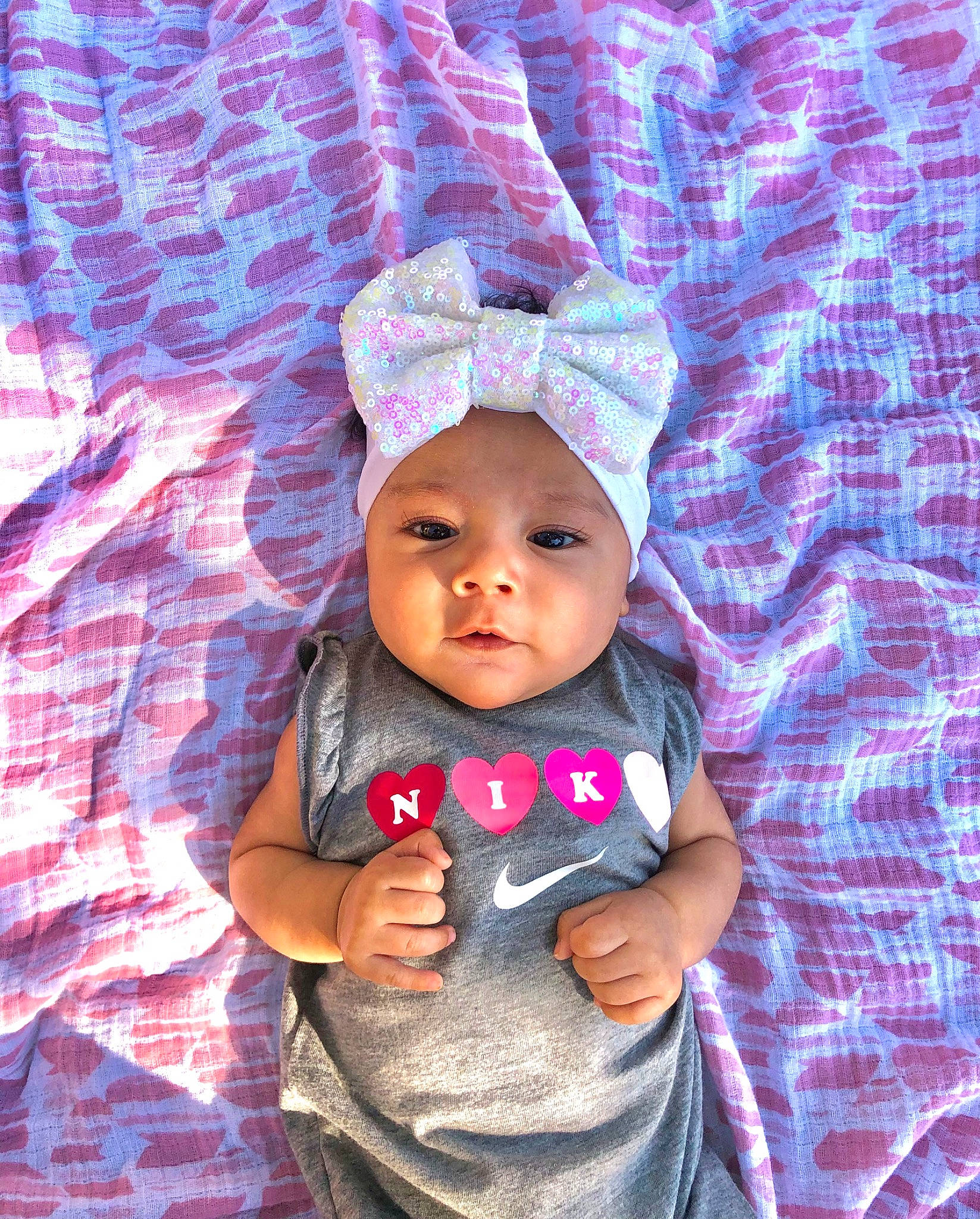 Blaise joined the competition — help win amazing prizes! baby, baby_toddler_clothing, cap, cheek, child, electric_blue, fashion_accessory, fun, happy, headwear, knit_cap, magenta, pattern, person, pink, purple, skin, sleeve, t_shirt, textile