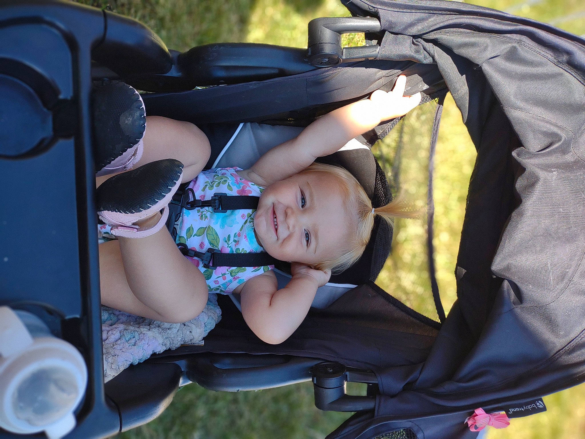 Alaya is registered to the contest to win money with this photo: auto_part, baby, baby_carriage, baby_products, bag, child, comfort, cool, fun, grass, happy, leisure, motor_vehicle, person, personal_protective_equipment, plant, product, recreation, sitting, toddler