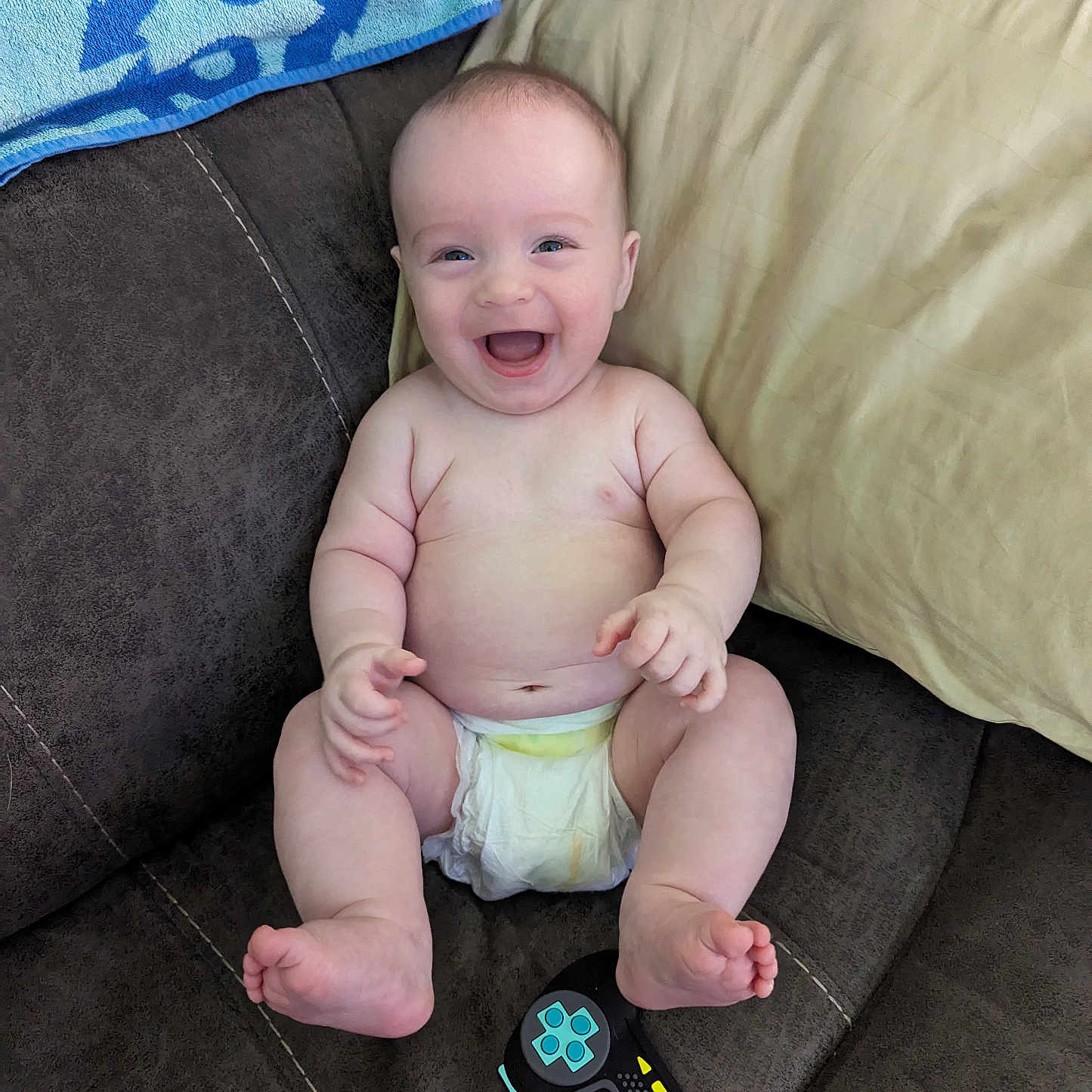 Nathan joined the competition — help win amazing prizes! baby, bodypart, clothing, couch, cushion, diaper, electronics, face, finger, footwear, furniture, hand, head, homedecor, newborn, person, photography, portrait, remotecontrol, sitting