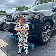 Loisa is registered to the contest to win money with this photo: alloywheel, car, car_exterior, carfront_damaged, carwash, carwheel, child, clothing, face, female, girl, machine, pants, person, spoke, suv, tire, transportation, vehicle, wheel