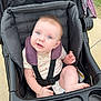 Esme joined the competition — help win amazing prizes! baby, stroller, child, blue_eyes, outdoor, graco, seatbelt, curious, infant, sitting, sidewalk, fabric, pink, purple, clothing, head, face, person, cute, toddler
