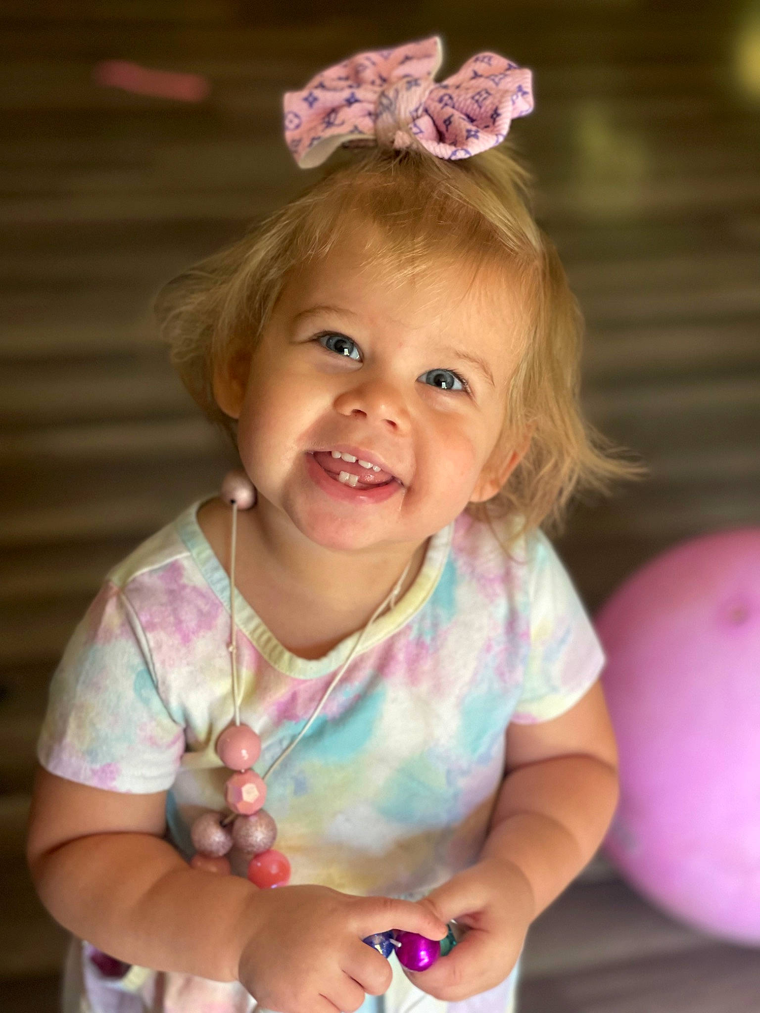 Aleah joined the competition — help win amazing prizes! baby, baby_toddler_clothing, cheek, child, dress, face, fashion_accessory, finger, fun, gesture, happy, headband, headpiece, iris, joy, magenta, nail, person, pink, skin