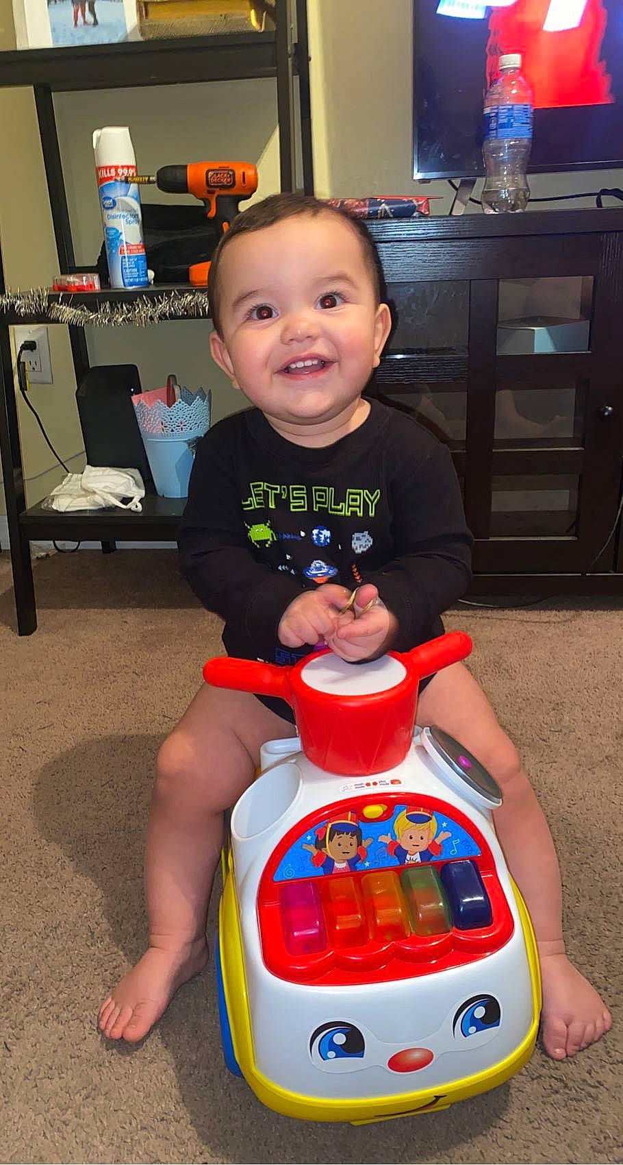 Armando joined the competition — help win amazing prizes! baby, baby_toddler_clothing, blue, cabinetry, carmine, chair, child, event, eye, face, flooring, fun, happy, joy, lap, person, shelf, shorts, smile, t_shirt