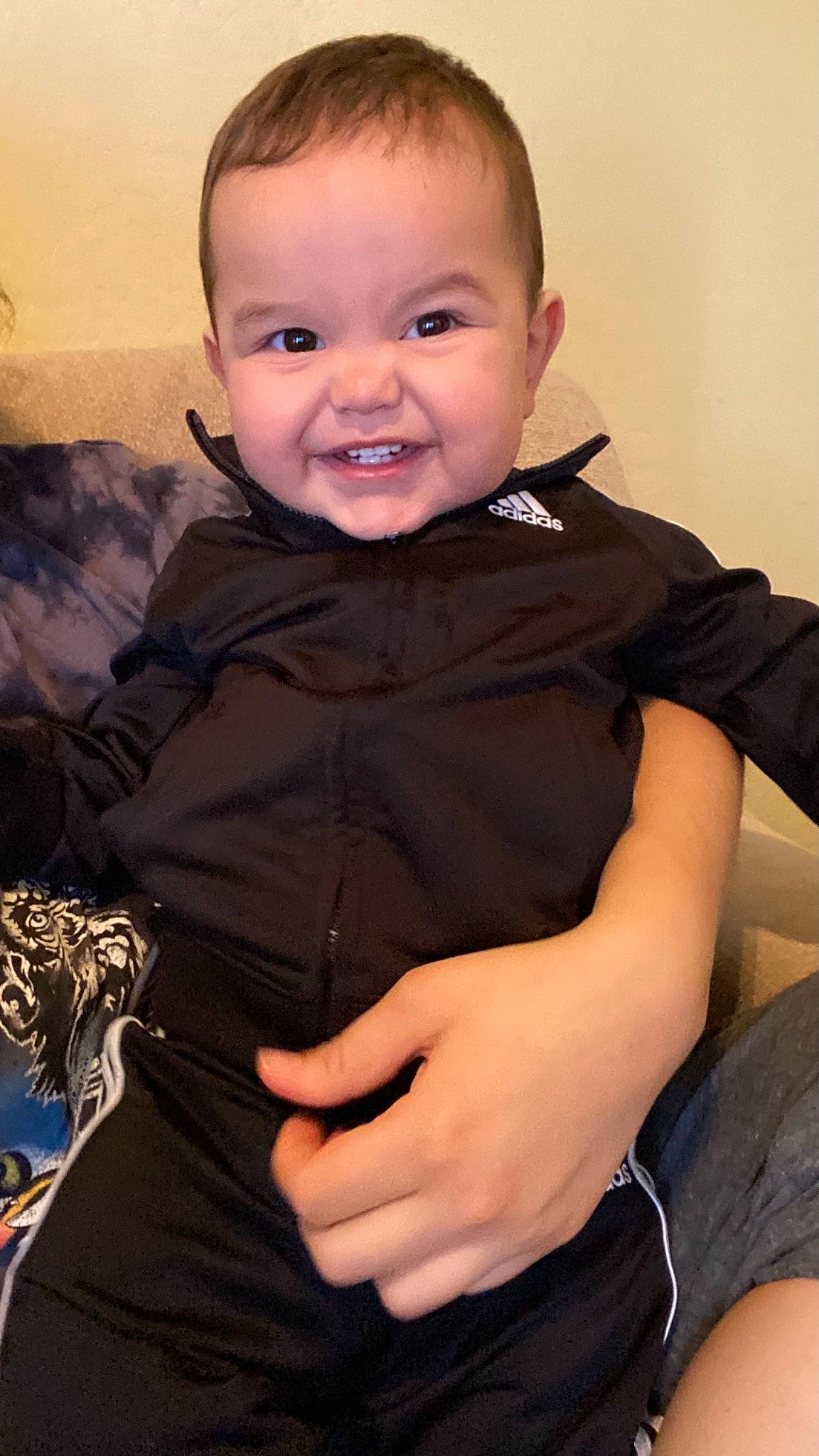 Armando is registered to the contest to win money with this photo: baby_toddler_clothing, cheek, eye, eyebrow, finger, flash_photography, gesture, happy, head, human, iris, joint, joy, lip, nose, organ, person, shoulder, skin, sleeve