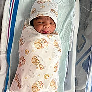 Ayan joined the competition — help win amazing prizes! baby, bed, blanket, child, cloth, cozy, cute, face, hat, hospital, infant, newborn, pattern, peaceful, person, sleeping, smiling, soft, swaddle, teddy_bear