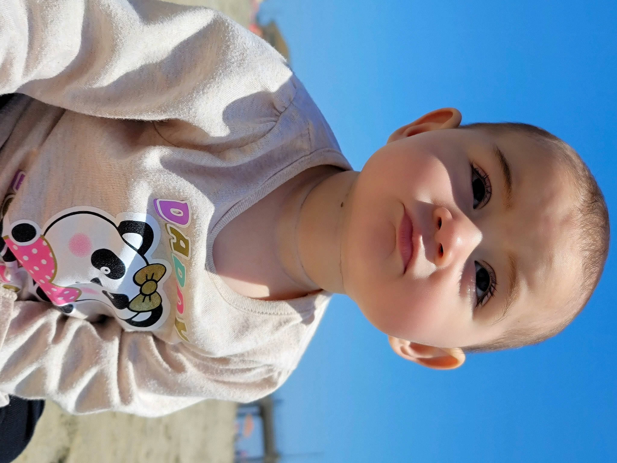Harlee is registered to the contest to win money with this photo: baby, baby_toddler_clothing, beauty, cheek, child, eyelash, flash_photography, fun, happy, leisure, neck, nose, pattern, person, photograph, skin, sky, sleeve, smile, t_shirt