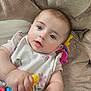 Amelia joined the competition — help win amazing prizes! baby, infant, child, toy, blanket, soft, cute, hand, face, eyes, clothing, pink, floral, comfort, closeup, portrait, lying_down, skin, young, indoors