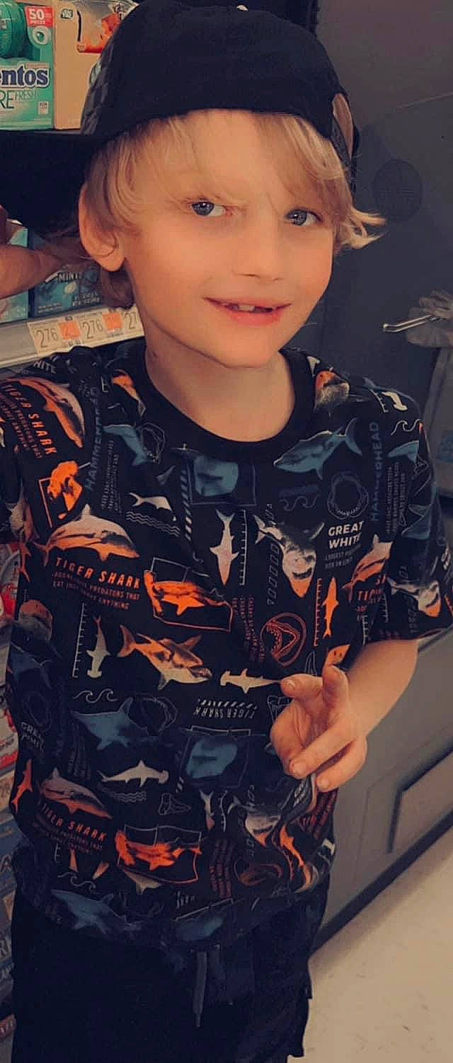 Jaxston joined the competition — help win amazing prizes! bangs, brown_hair, child, cool, fashion, flash_photography, fun, hairstyle, happy, headwear, joy, mouth, organ, pattern, person, portrait_photography, sitting, sleeve, smile, t_shirt