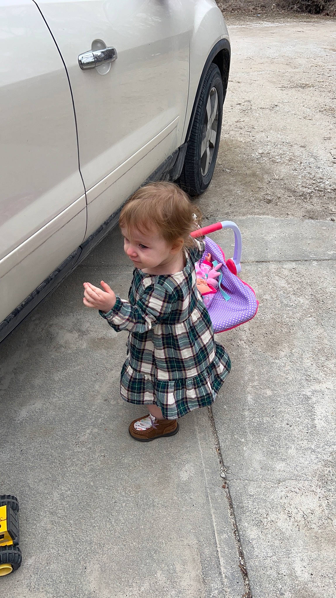 Madilyn joined the competition — help win amazing prizes! alloy_wheel, automotive_design, automotive_exterior, automotive_lighting, automotive_tire, automotive_wheel_system, bumper, car, fender, hood, motor_vehicle, person, plaid, rim, road_surface, tartan, tire, toddler, vehicle, vehicle_door