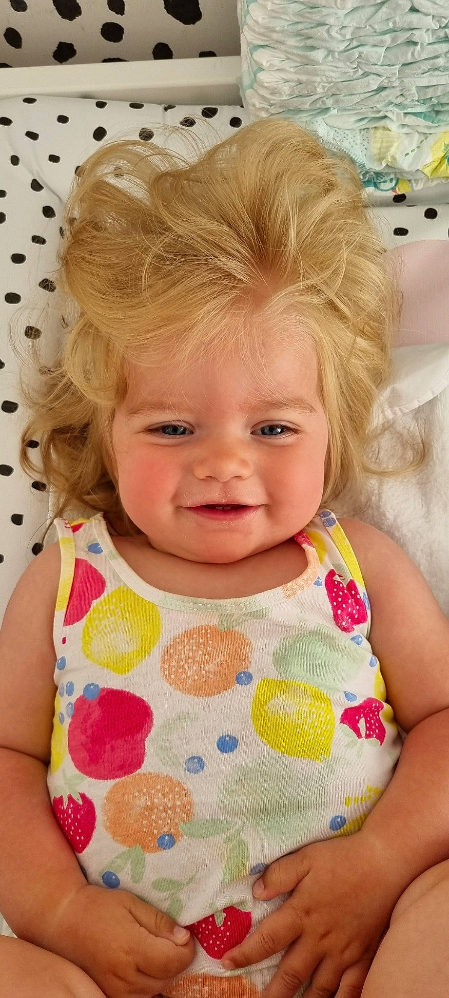 Alba is registered to the contest to win money with this photo: arm, baby_toddler_clothing, cheek, chin, dress, eye, eyelash, facial_expression, hairstyle, happy, head, iris, joy, lip, neck, nose, organ, outerwear, person, skin