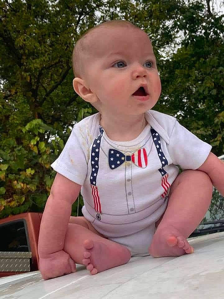 Caspian joined the competition — help win amazing prizes! baby, baby_toddler_clothing, cheek, chin, dress, facial_expression, fun, grass, hairstyle, happy, head, leisure, person, pink, plant, sitting, skin, sleeve, surprise, t_shirt