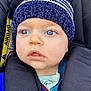toddler, child, blue_eyes, knitted_hat, car_seat, baby, face, clothing, seatbelt, straps, outerwear, portrait, infant, cute, closeup, sitting, young_child, expression, indoors, safety
