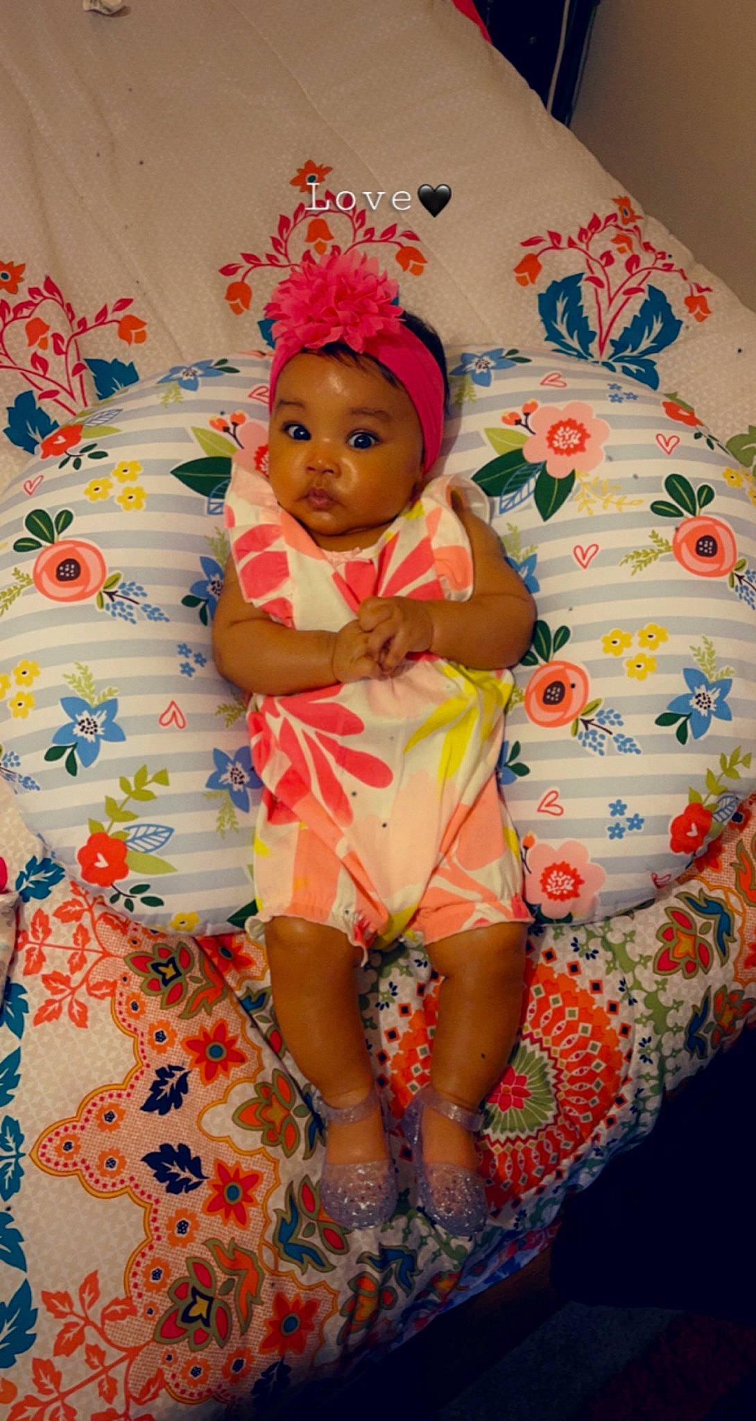 Kassidy joined the competition — help win amazing prizes! baby, baby_toddler_clothing, child, comfort, eye, fun, happy, head, headwear, human_leg, linens, orange, pattern, peach, person, pink, room, skin, sleeve, textile