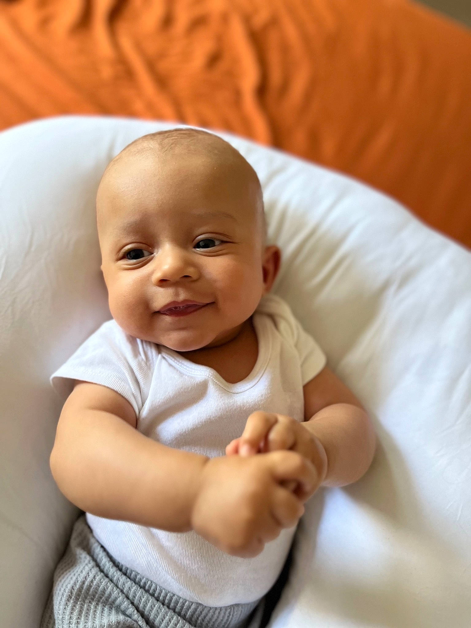 Ever is registered to the contest to win money with this photo: arm, baby, baby_products, baby_toddler_clothing, cheek, child, chin, comfort, elbow, gesture, hand, happy, lip, nail, person, sitting, skin, sleeve, smile, thumb