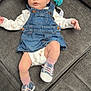 baby, infant, denim, overall, pink_bow, headband, couch, sofa, pacifier, sneakers, pink_socks, clothing, person, indoor, cute, expression, looking, child, legs, feet