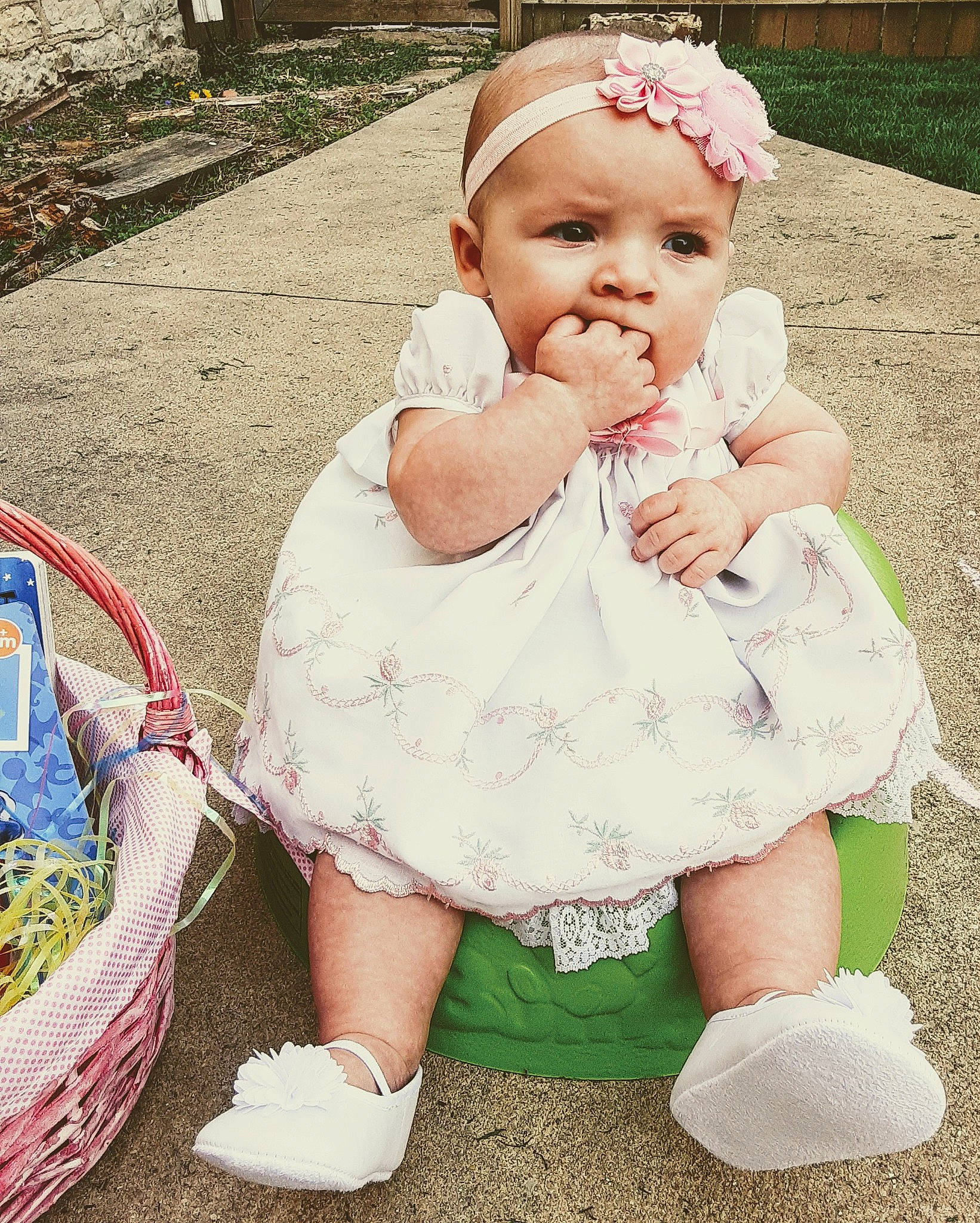 Jenna is registered to the contest to win money with this photo: baby, baby_products, baby_toddler_clothing, cheek, child, dress, eye, grass, hair_accessory, headwear, people, person, pink, play, product, sitting, skin, smile, toddler