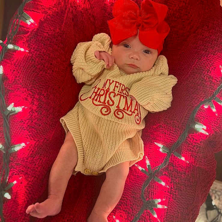Paisley R. joined the competition — help win amazing prizes! baby, cap, chair, clothing, costume, couch, cushion, face, furniture, glove, hat, head, homedecor, kissing, lighting, newborn, person, photography, portrait, sleeping
