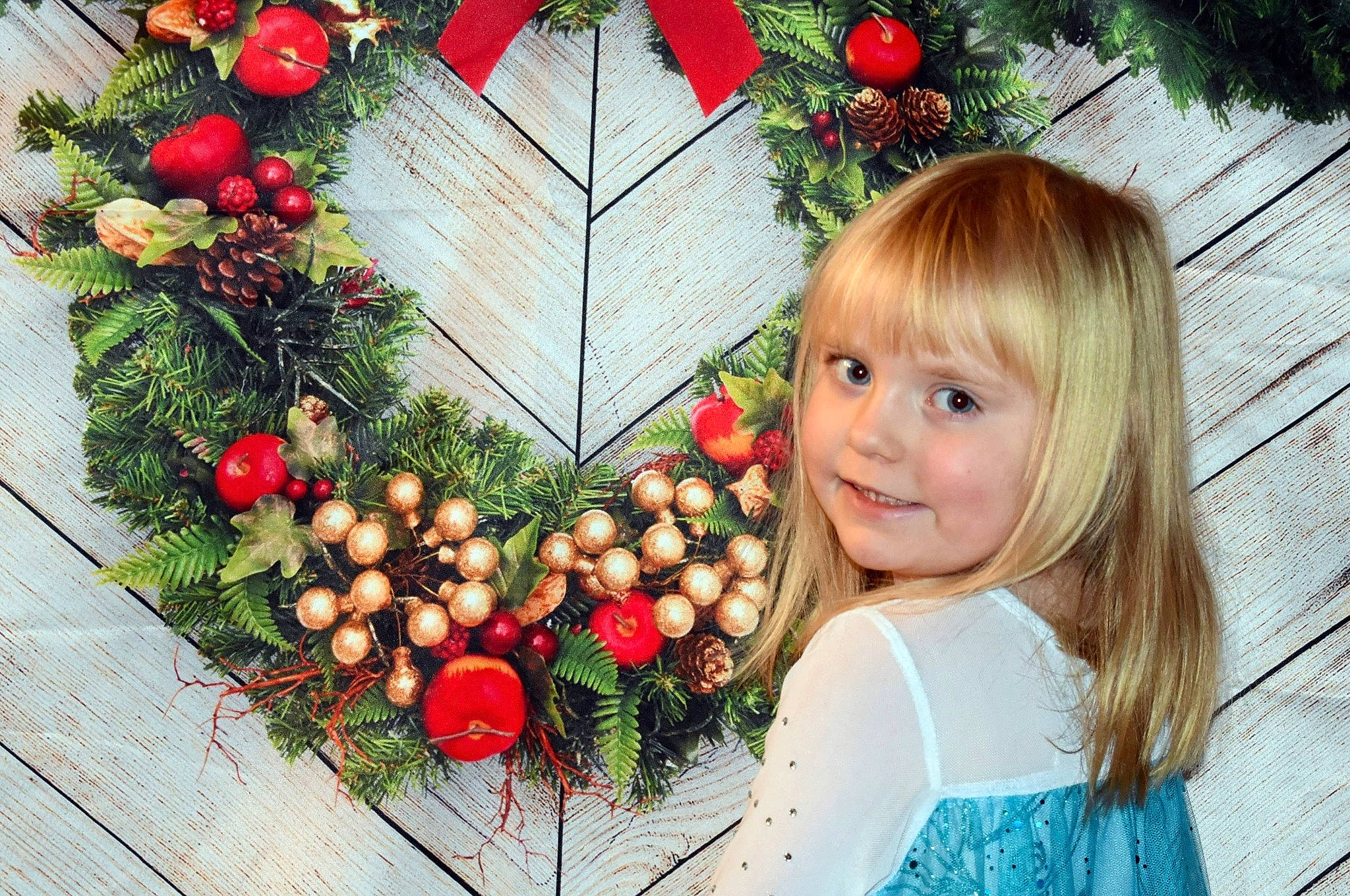 Brooklyn is registered to the contest to win money with this photo: berry, child, christmas, christmas_decoration, christmas_eve, christmas_ornament, fir, floral_design, floristry, flower, fruit, holiday, holly, interior_design, joy, person, plant, toddler, tree, twig