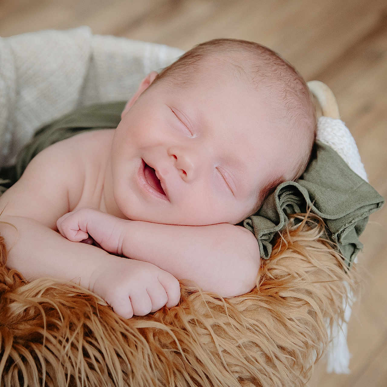 Kohen joined the competition — help win amazing prizes! baby, blanket, bodypart, face, finger, hand, happy, hardwood, head, newborn, person, photography, portrait, sleeping, smile, wood