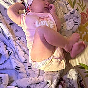 Adalynn joined the competition — help win amazing prizes! baby, sleeping, infant, blanket, headband, onesie, floral, cozy, soft_lighting, peaceful, cute, child, indoors, resting, newborn, warm_colors, fabric, pattern, comfort, lying_down