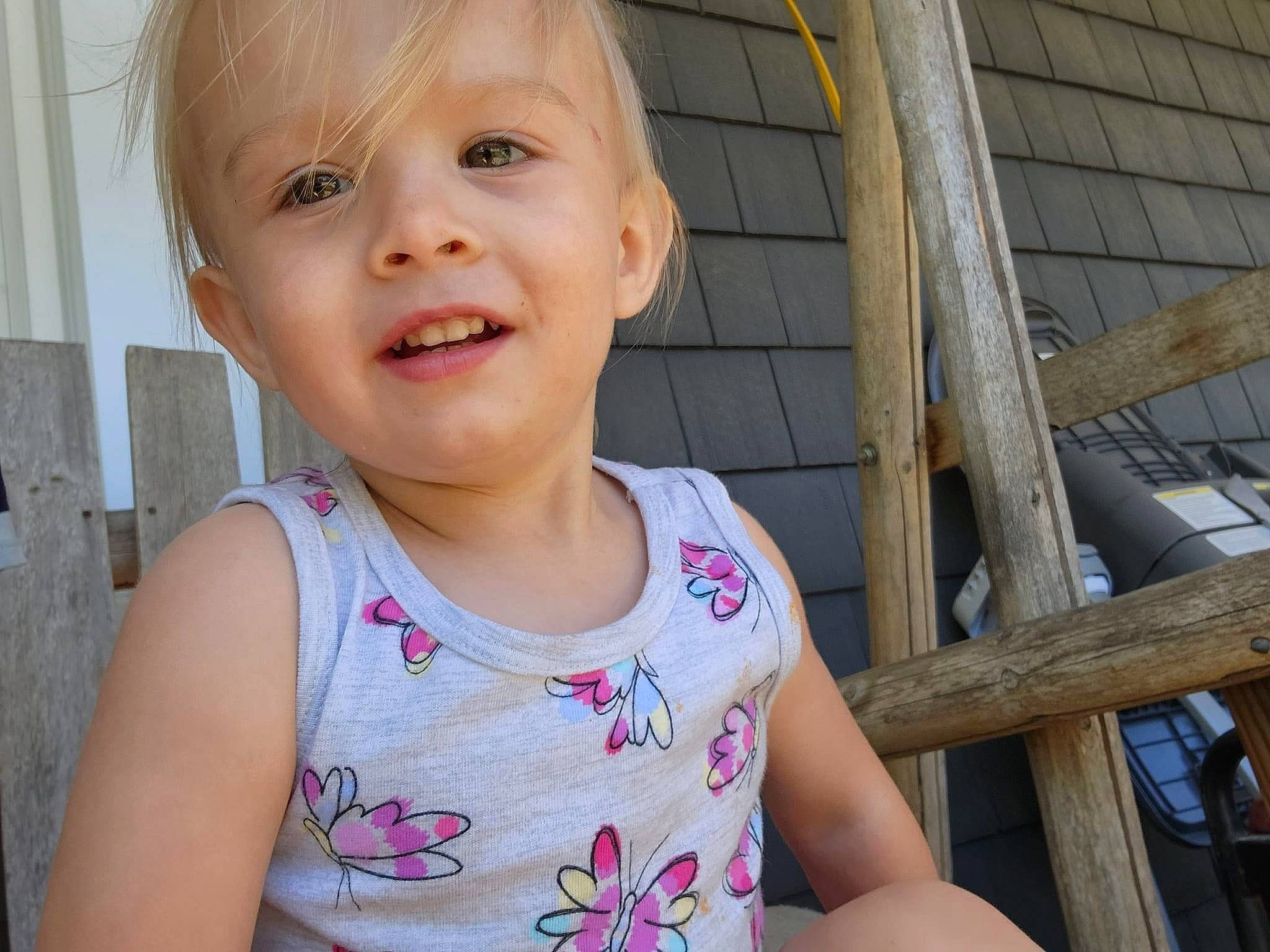 Paisley is registered to the contest to win money with this photo: baby_toddler_clothing, cheek, chin, eye, eyelash, hair, happy, head, iris, lip, mouth, neck, nose, person, pink, skin, sleeve, smile, standing, toddler