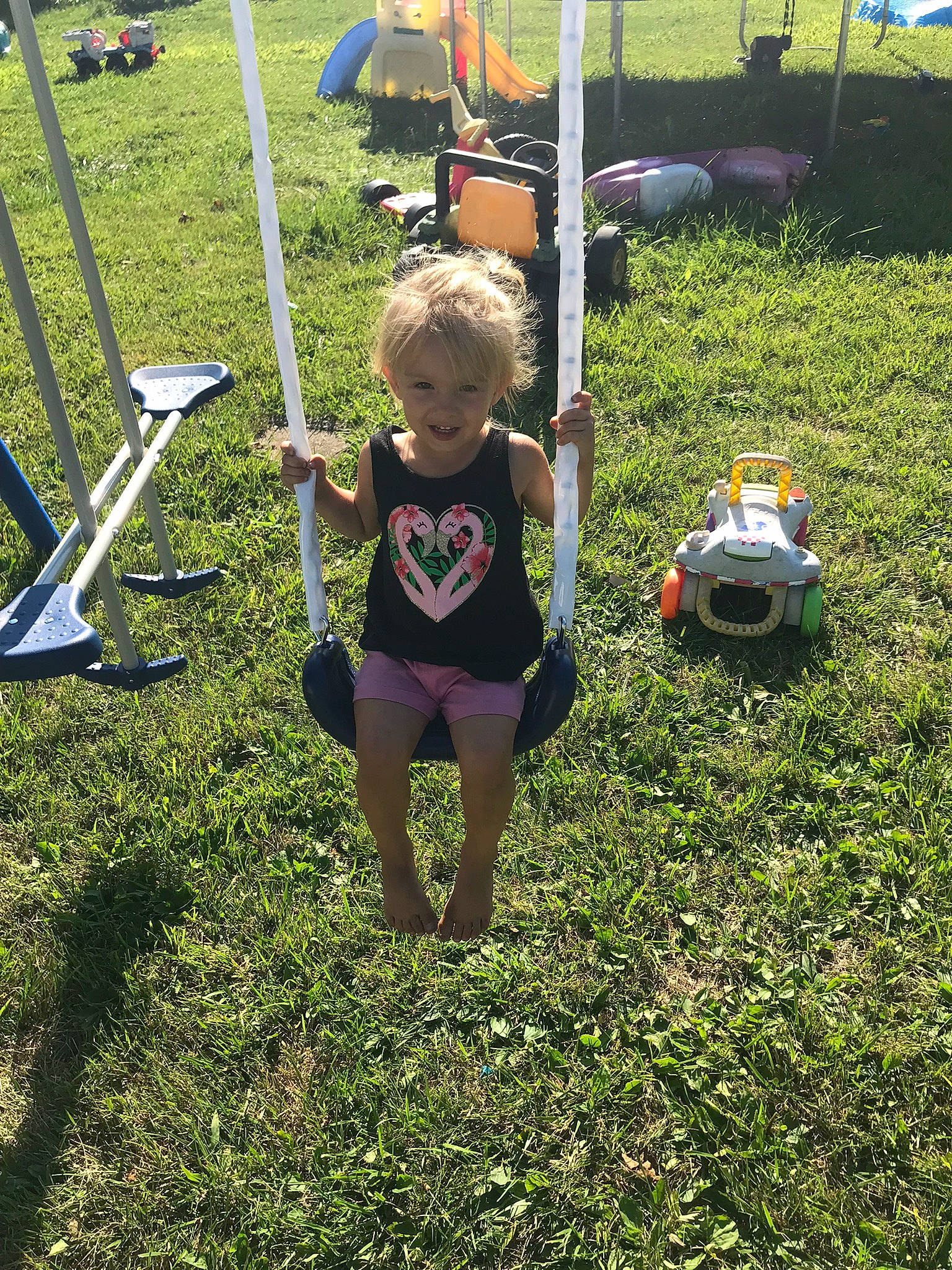 Paisley joined the competition — help win amazing prizes! chair, child, city, fun, grass, grassland, landscape, lawn, leisure, outdoor_furniture, outdoor_play_equipment, people_in_nature, person, plant, play, recreation, shorts, soil, t_shirt, toddler