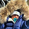 Junie joined the competition — help win amazing prizes! baby, infant, sleeping, winter, coat, puffer_jacket, fur_hood, hat, pacifier, blue_clothing, outdoor, cold_weather, portrait, close_up, face, eyes_closed, bundled_up, child, snowy_weather, jacket